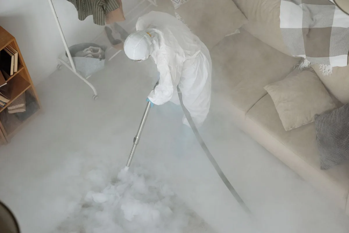 Biohazard cleanup technician in protective equipment, Wellston, OH